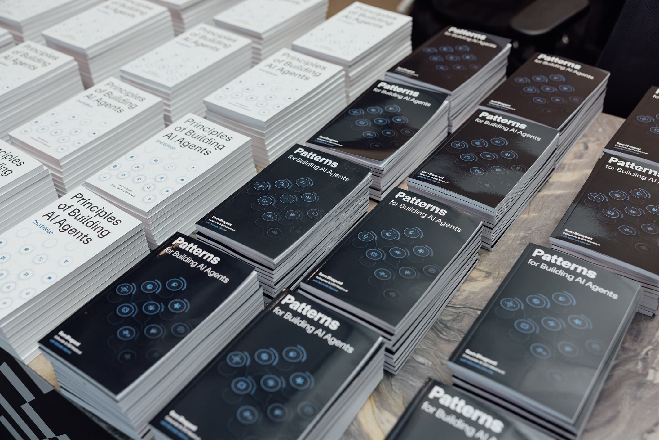 Patterns for Building AI Agents stacked on a shelf.